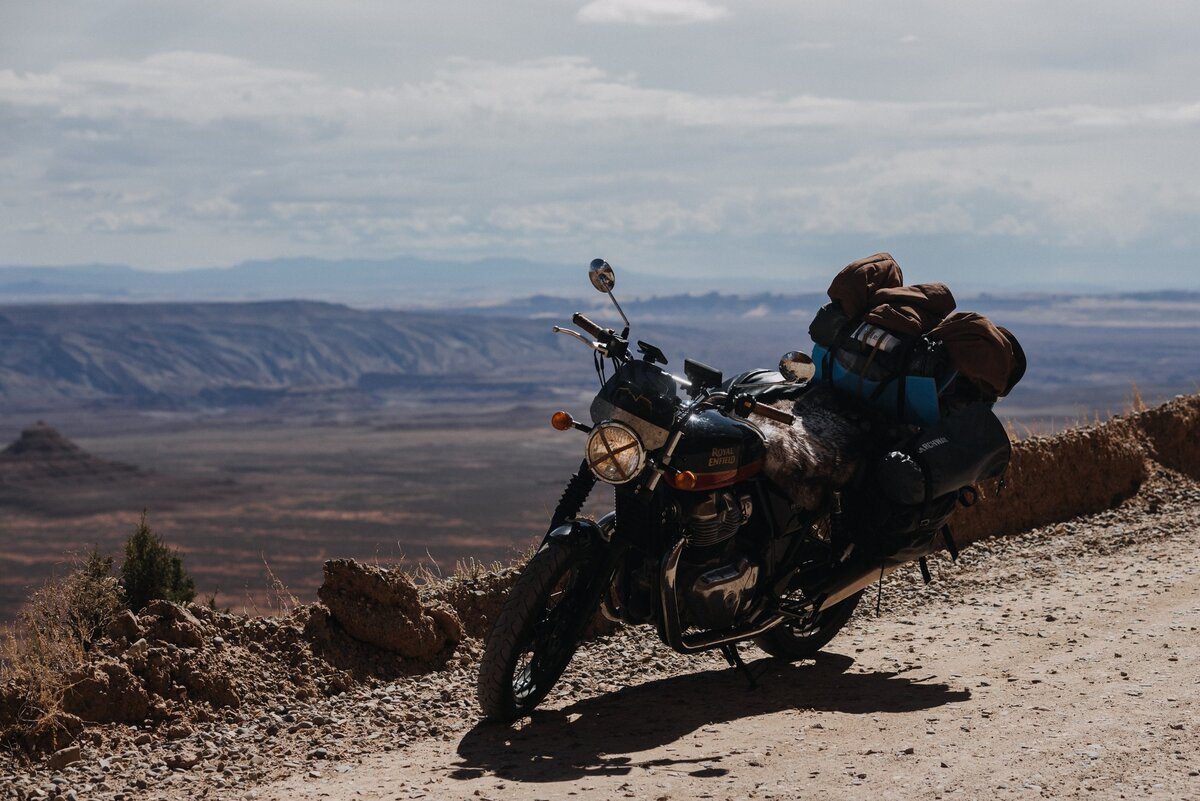 Motorcycle on a red dirt canyon road