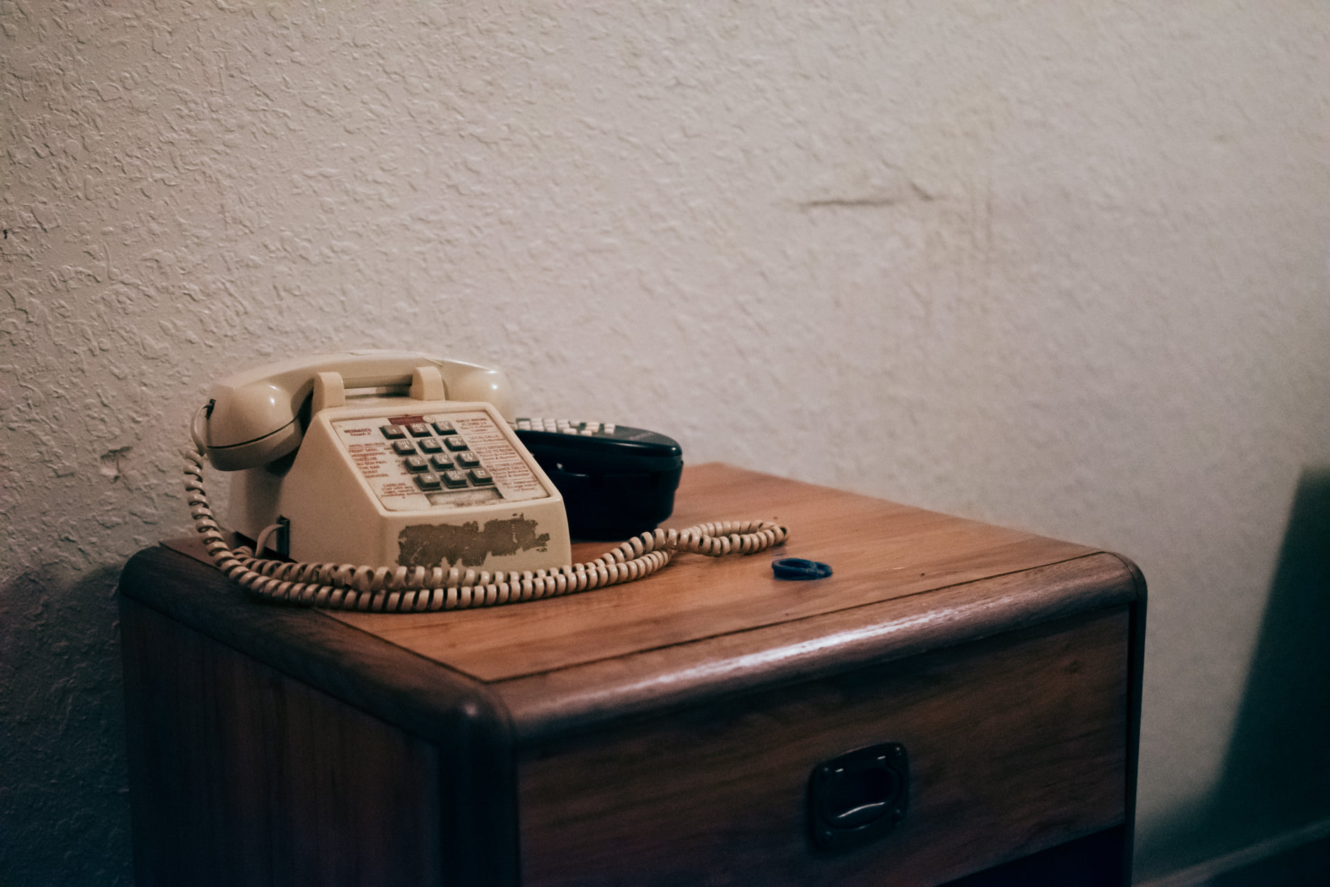 Vintage typewriter on a nightstand from The Nikon Kidd Original Journey hitchhiking, trainhopping, and vanlife archive.
