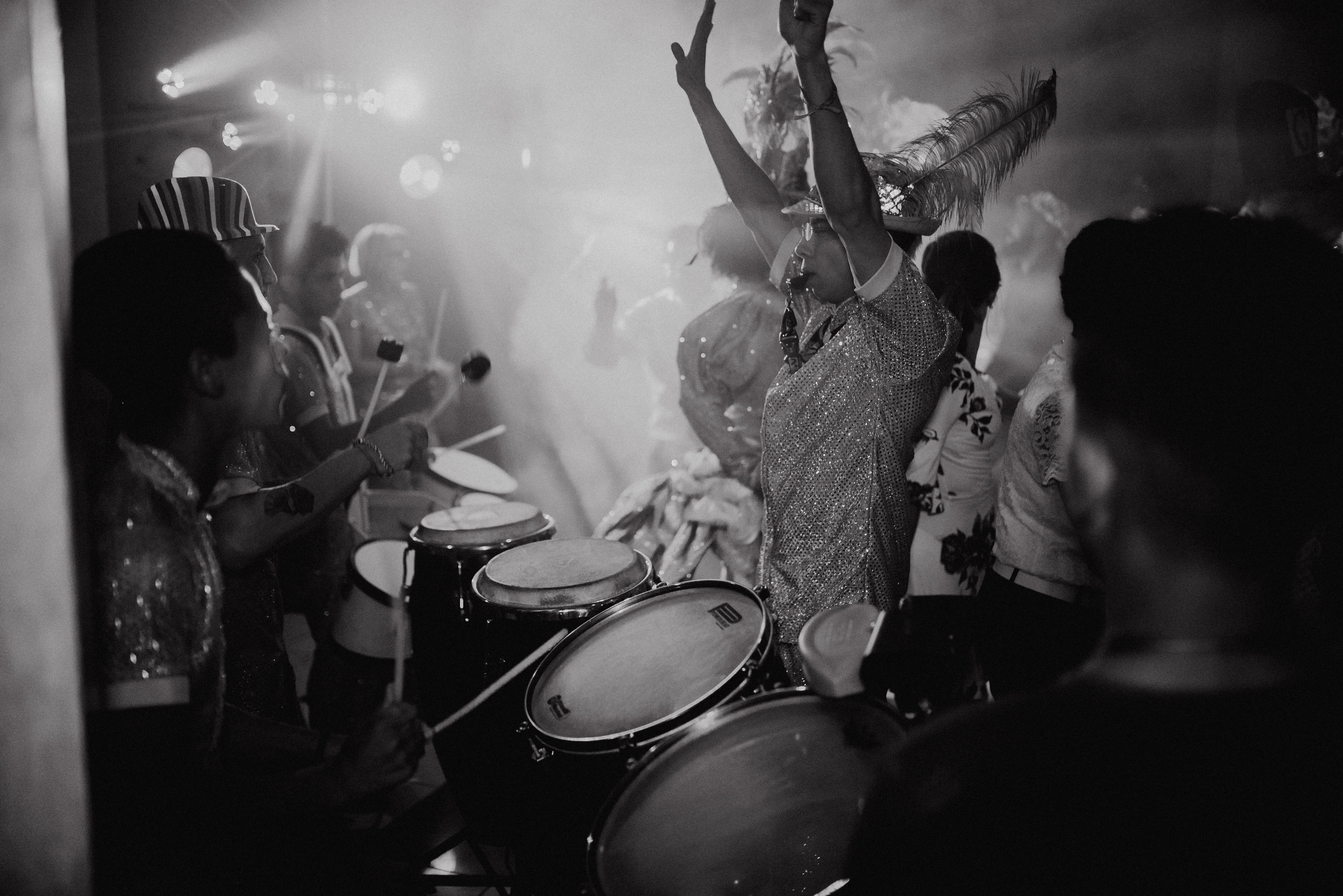 Live hora loca drummers and percussion performers at a Costa Rica wedding reception in black and white